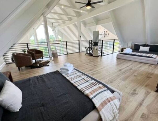 The loft bedroom of the lodge with two queen beds